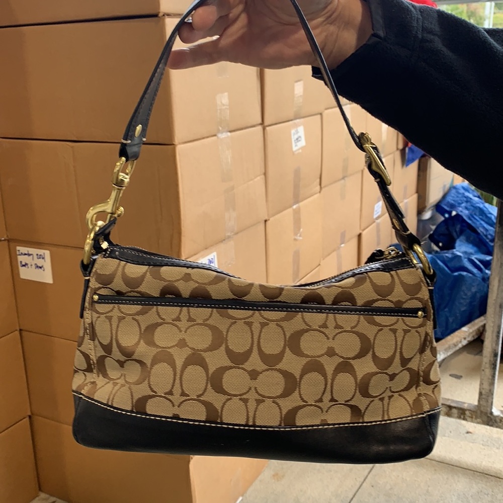 Coach signature; dark brown leather trim.  Gently used.